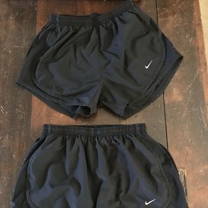 Two Black Nike Dri-Fit shorts